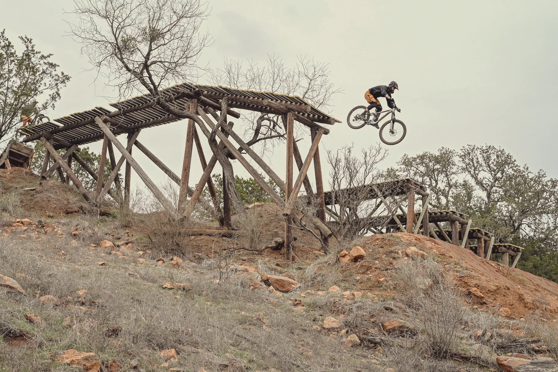 Mountain biking, a drop off a wooden ramp