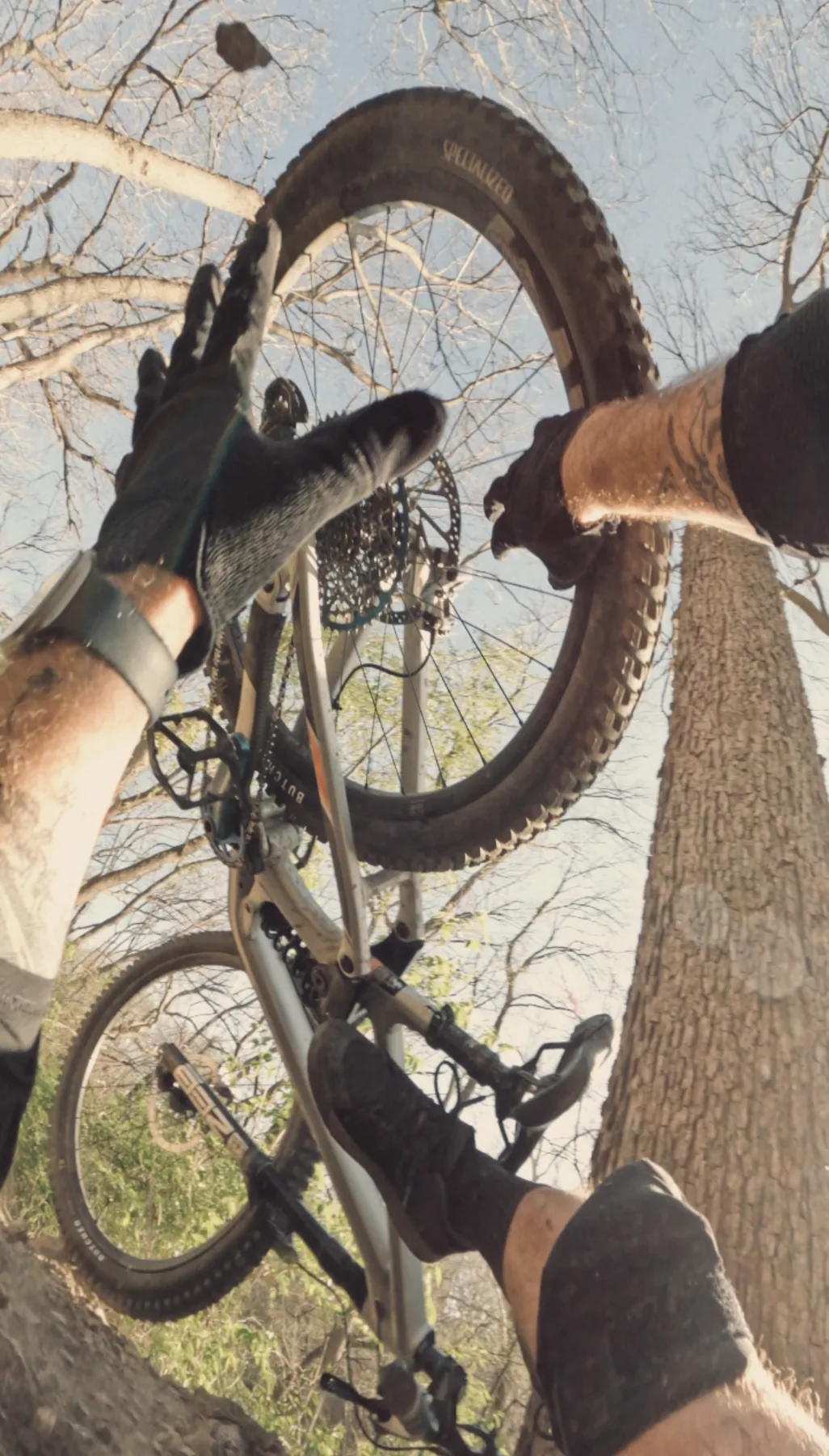 Holding a mountain bike overhead